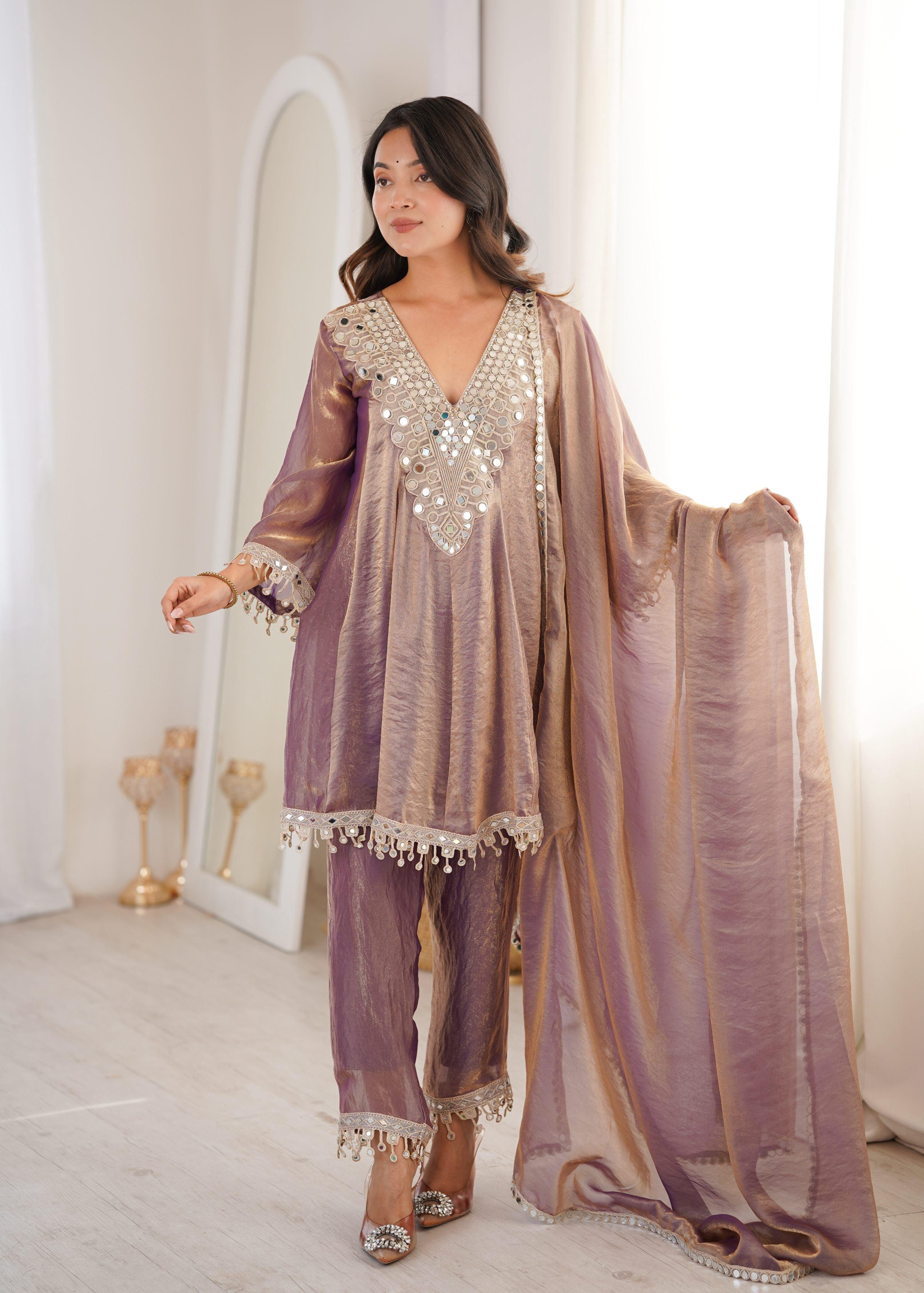 Woman wearing a purple Fendy embroidered designer kurta set with matching dupatta