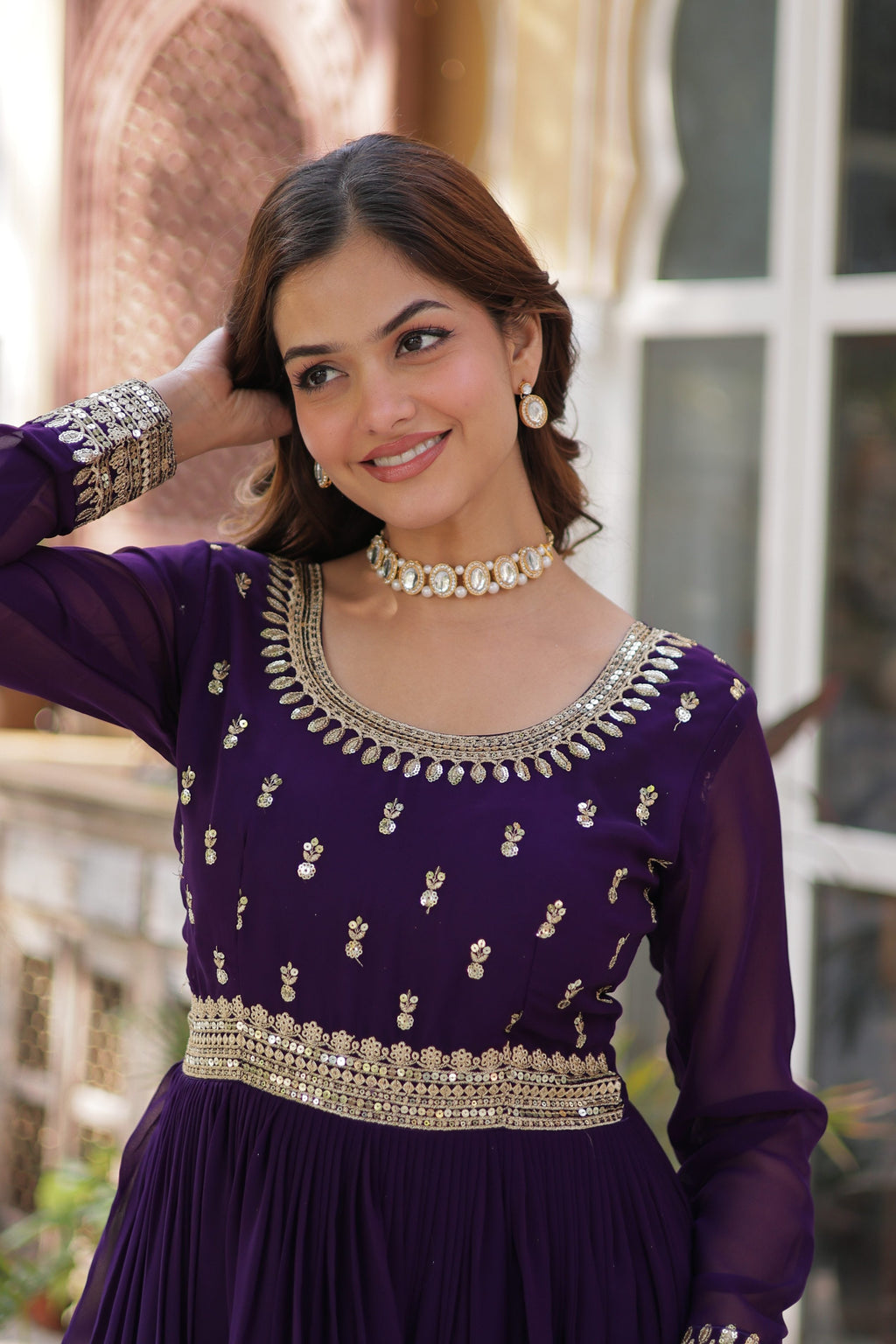 A full-length view of a purple Faux Blooming Anarkali set with detailed sequins and zari embroidery.