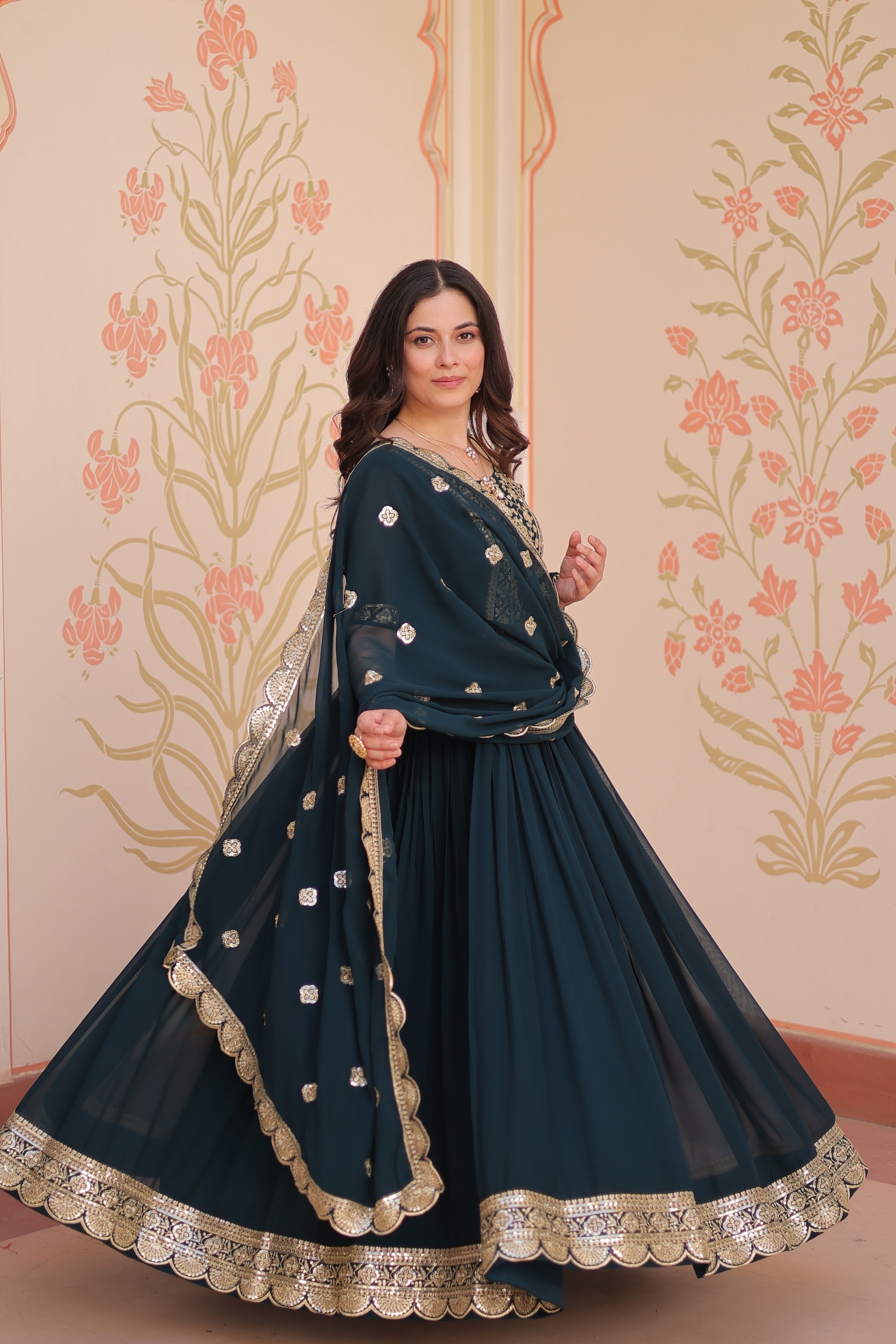 Rama colored Anarkali set in Faux Blooming fabric with sequins and Zari embroidery detailing.