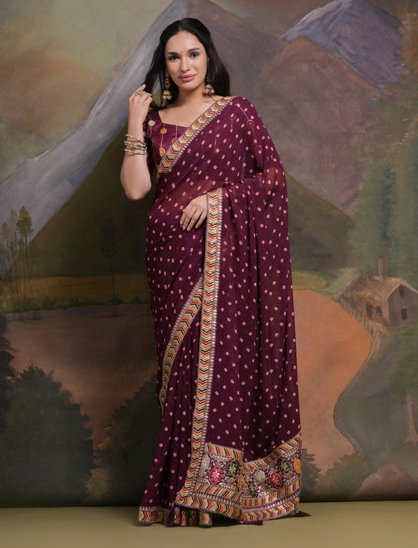 Wine-colored georgette saree featuring detailed coding and sequence embroidery with a matching blouse.