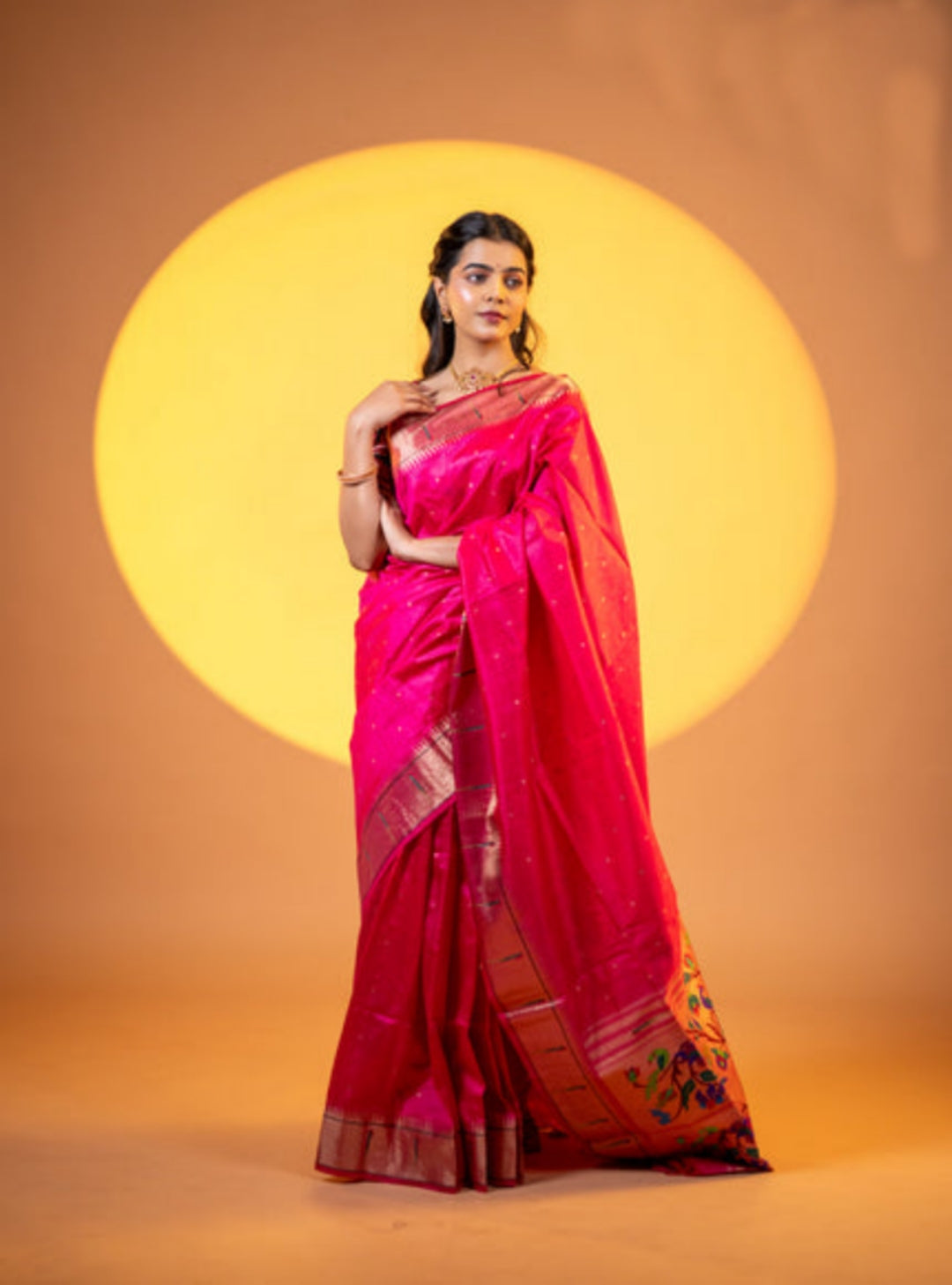 A beautiful pink soft khadi raw silk saree with intricate meena weaving and zari border