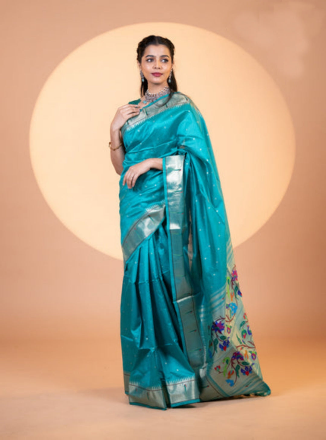 Rama colored soft khadi raw silk saree featuring Meena weaving and jhalar border