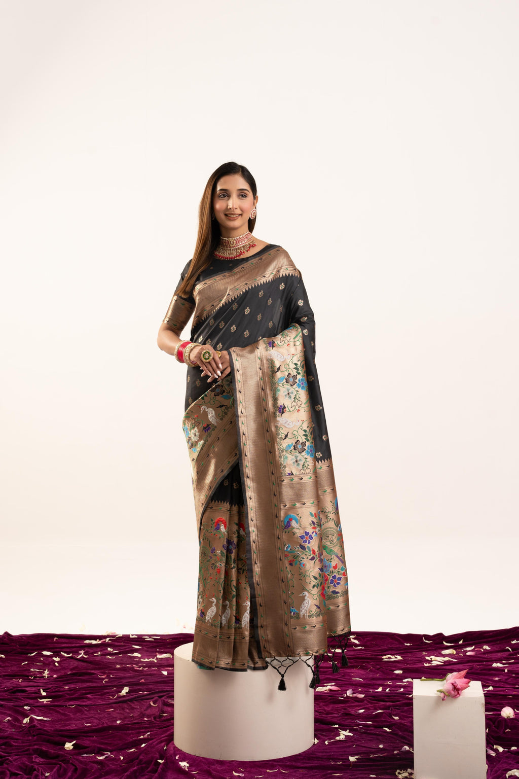 Elegant black Banarasi silk saree with gold Zari woven borders and matching blouse piece