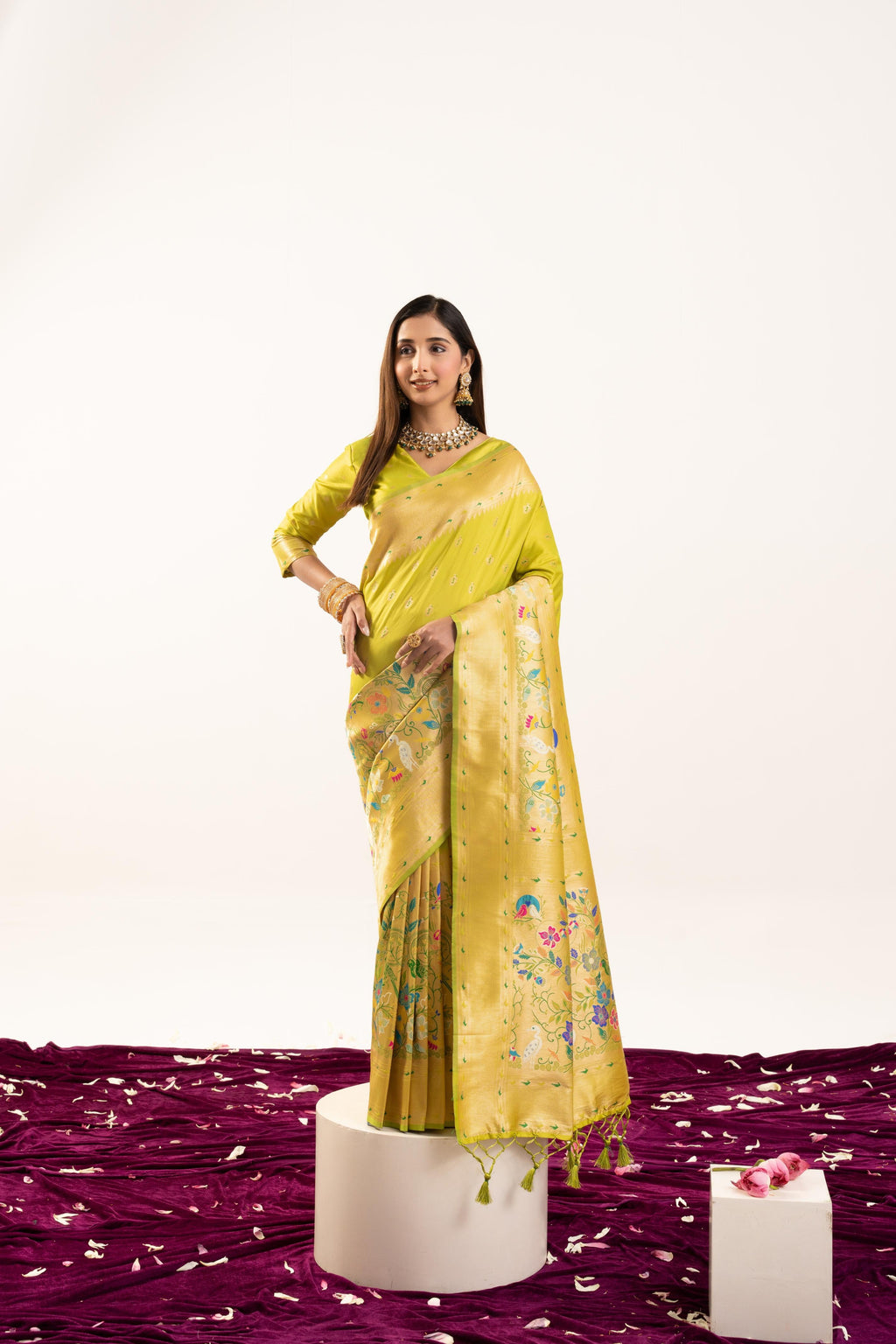 Pista soft Banarasi silk saree with intricate gold zari weaving and matching blouse.