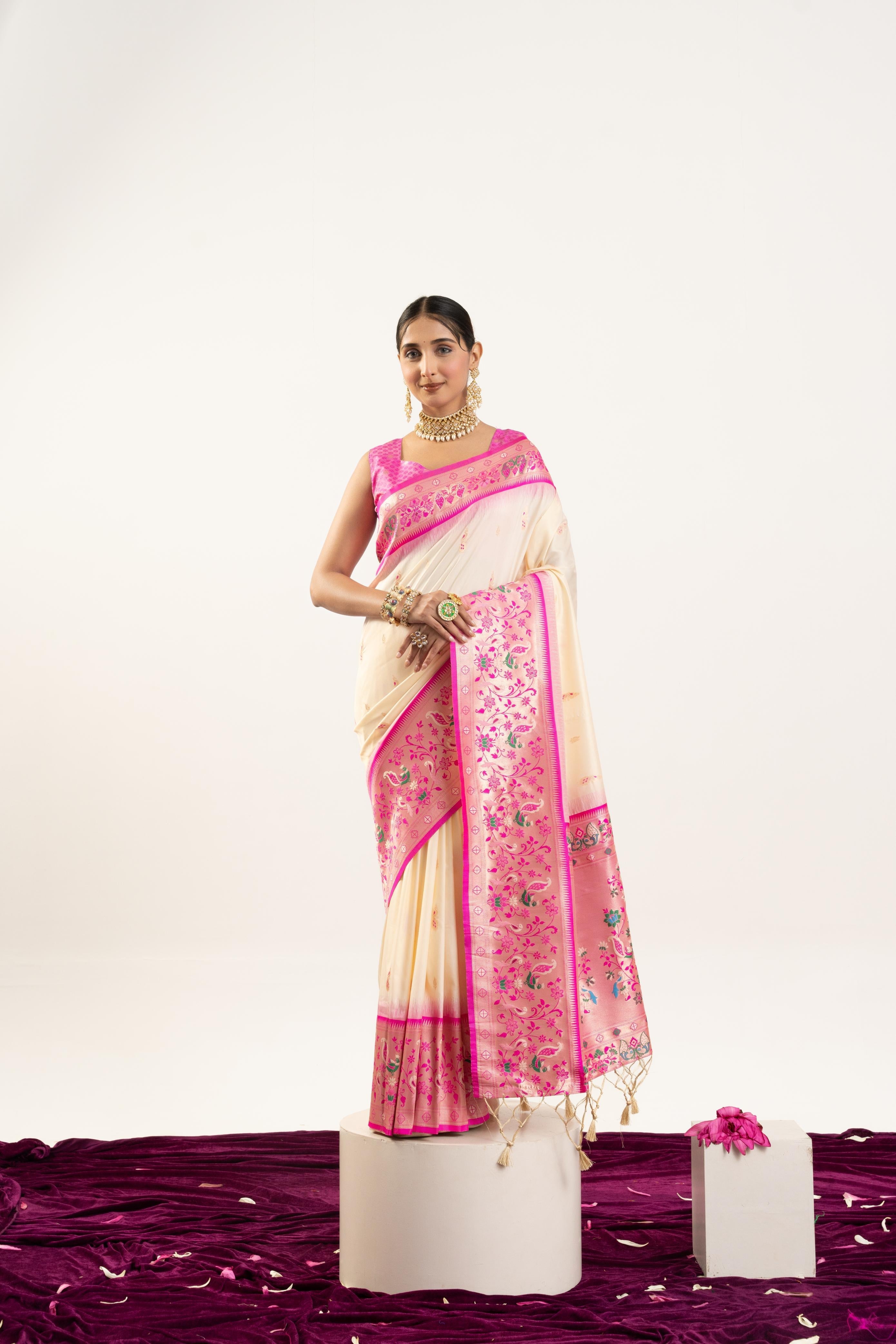 Classic cream soft Banarasi silk saree with a refined Zari woven border, including a blouse piece.