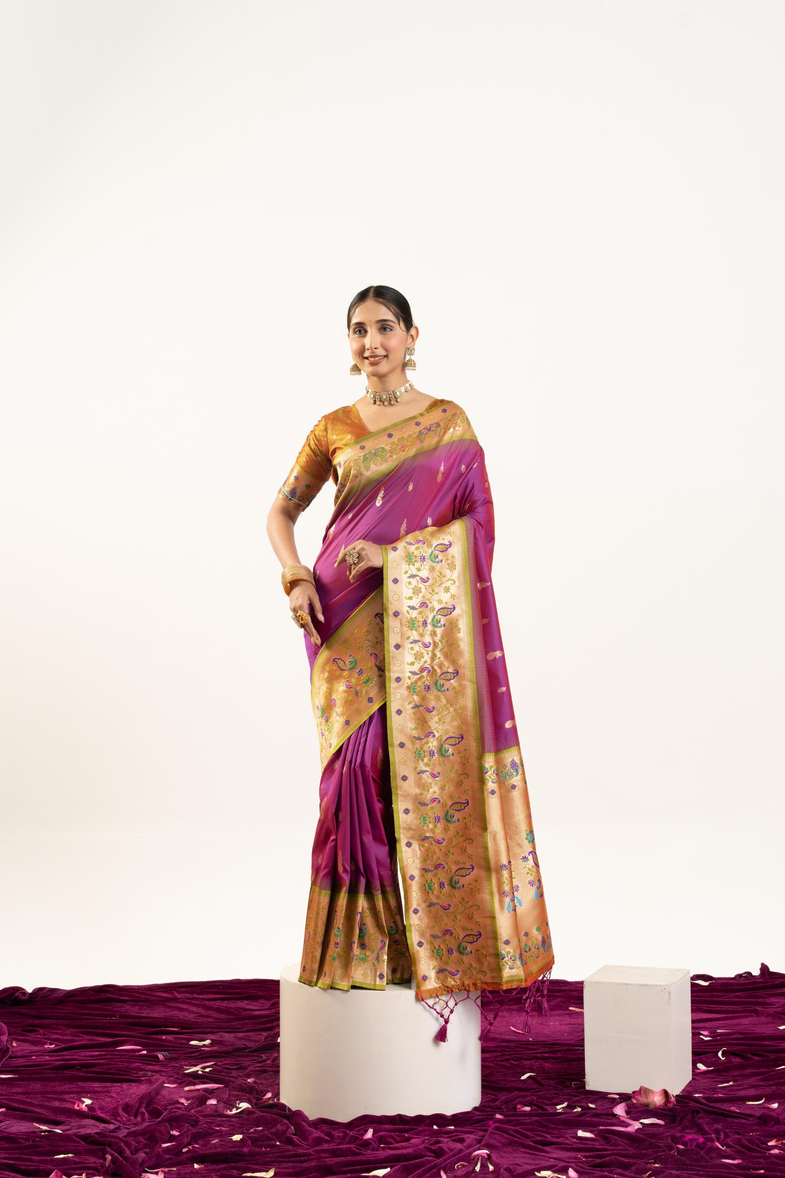 Wine colored soft Banarasi silk saree with ornate Zari woven patterns and blouse