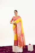 Yellow soft Banarasi silk saree with traditional zari woven border and matching blouse
