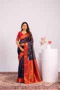 Elegant blue soft tissue silk saree with intricate gold zari woven patterns and matching unstitched blouse fabric.