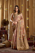 Cream colored Banarasi saree with digital cluster prints and tassels