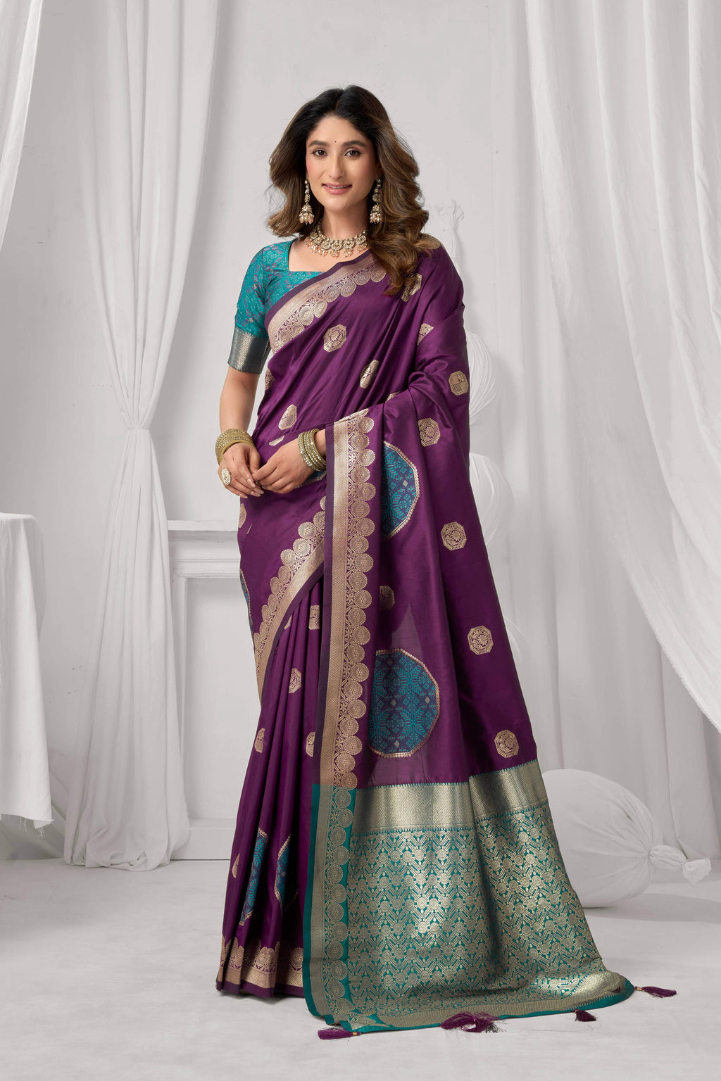 Wine colored Soft Silk saree featuring Zari woven designs and a matching blouse