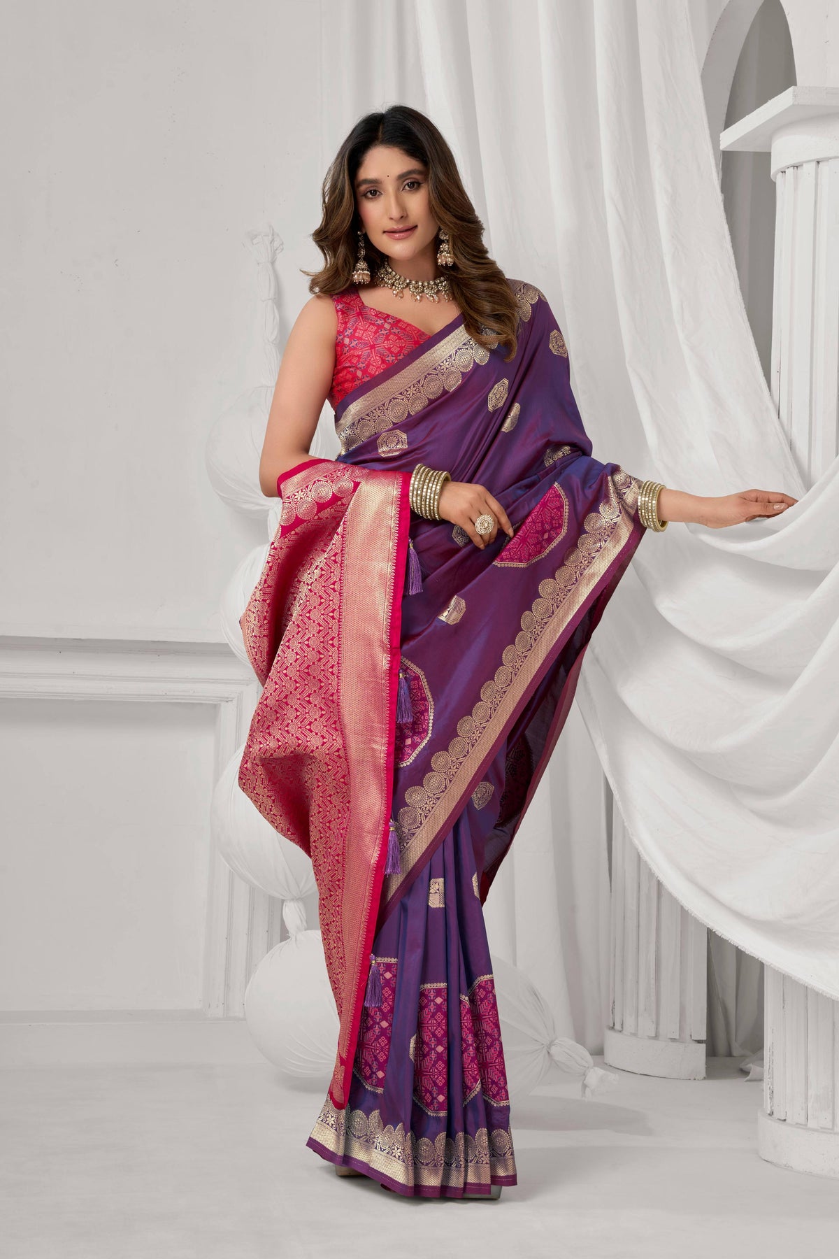 Elegant purple soft silk saree with intricate gold zari woven details and matching unstitched blouse piece