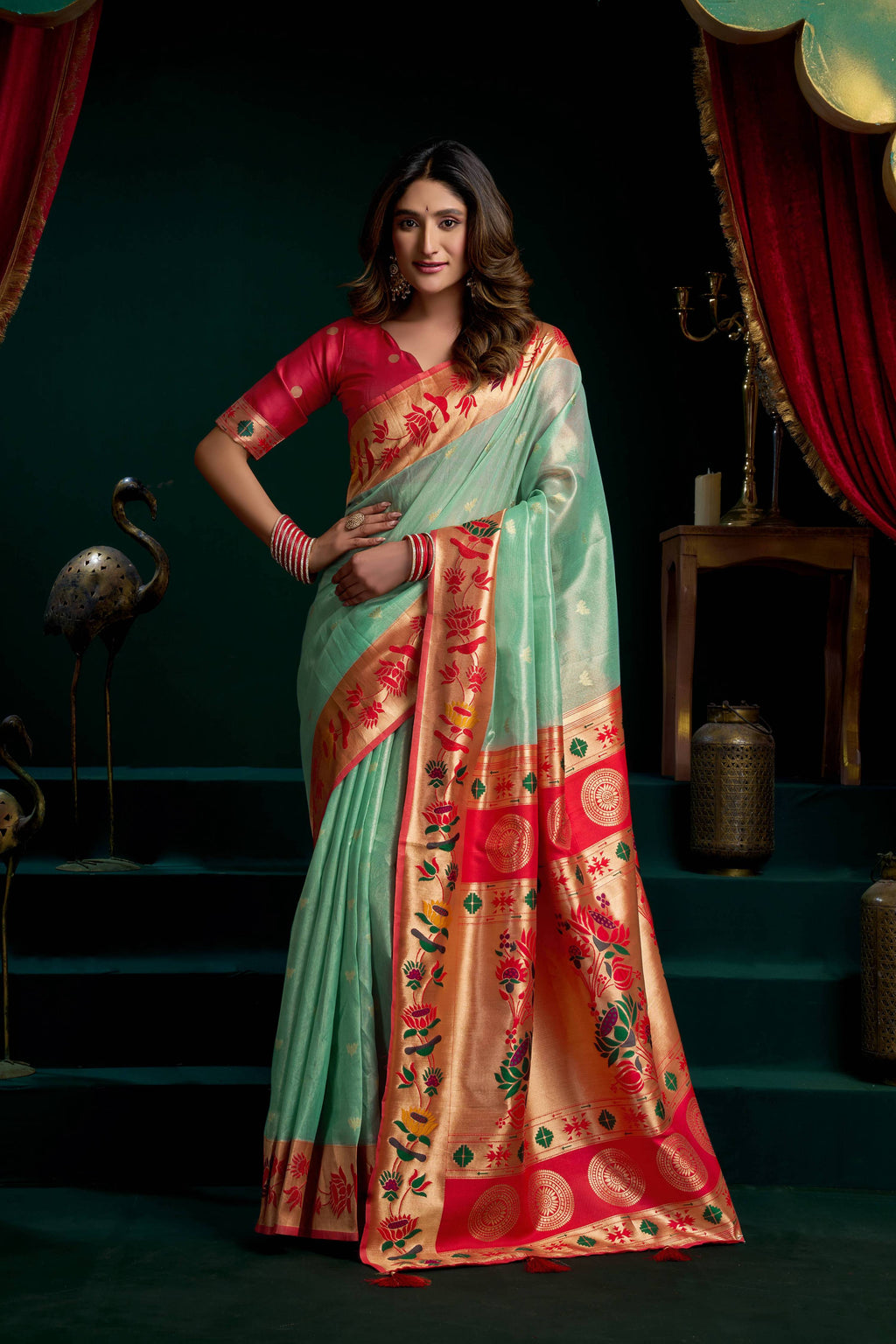 Sea Green Tissue Paithani saree with lotus Zari work and matching blouse