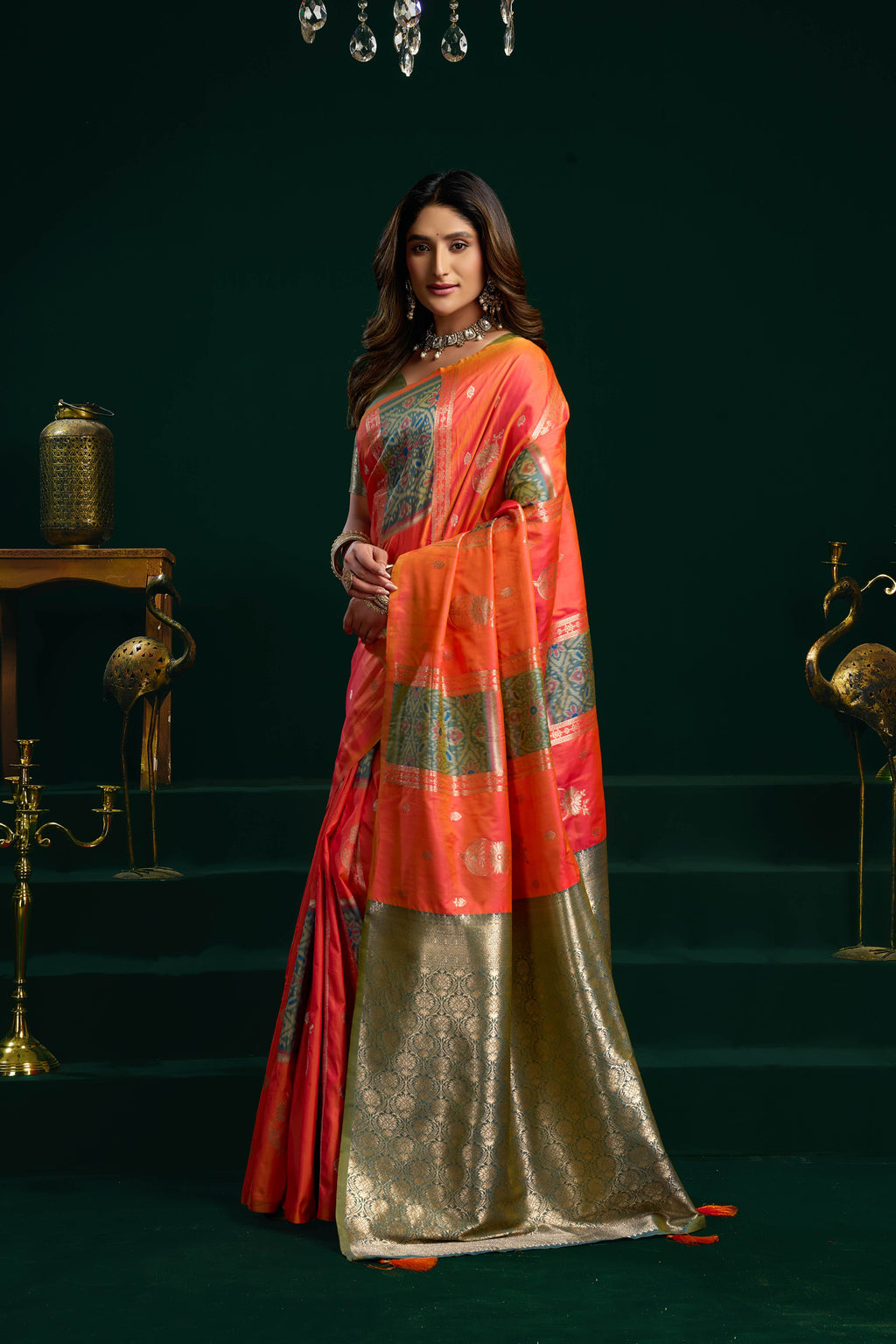 Orange soft silk saree featuring fancy pumpum work and Zari woven border