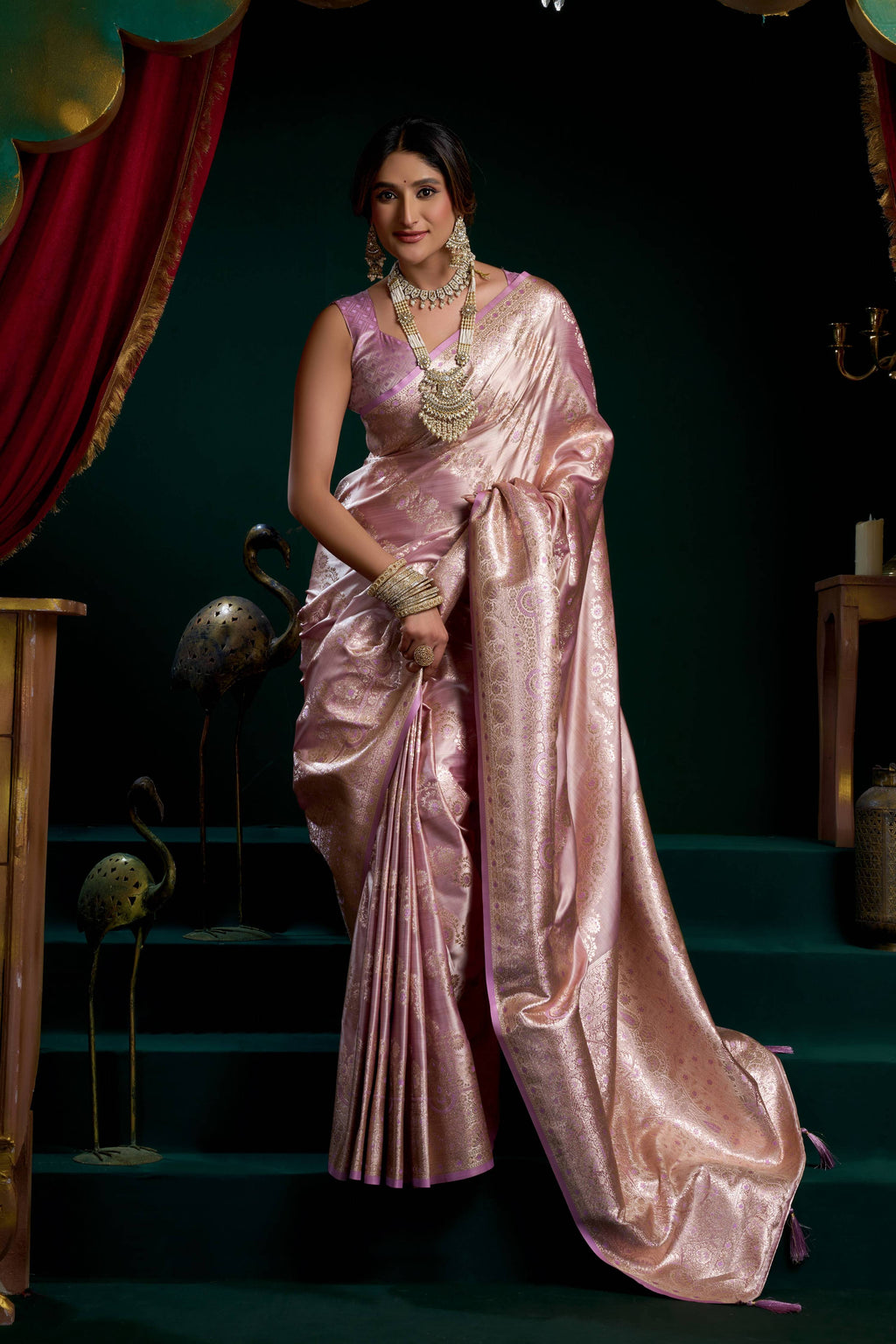 Luxurious purple satin silk saree with fancy pumpum accents and Zari woven borders.