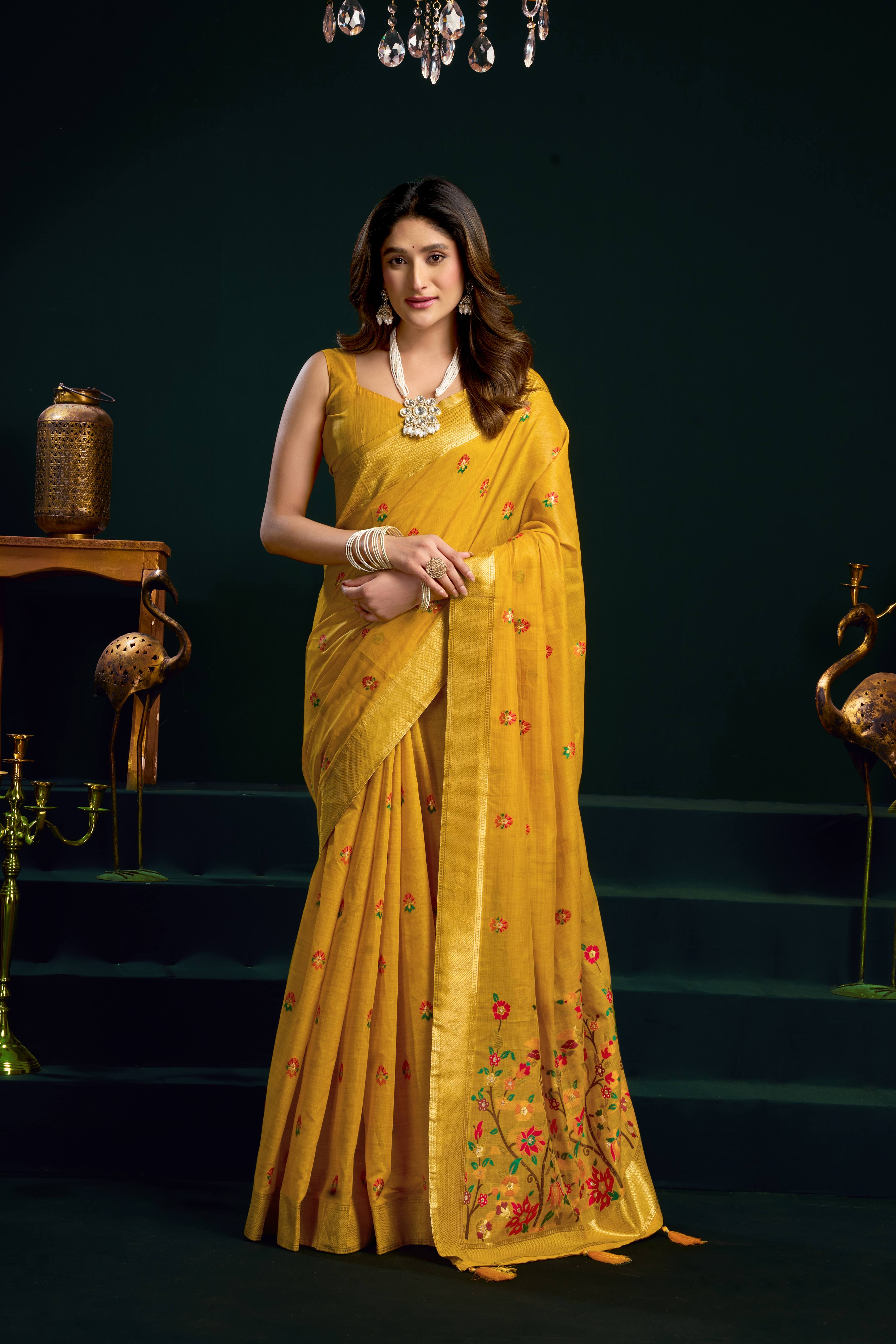 Yellow muga cotton saree featuring colorful meena zari woven borders and matching blouse piece