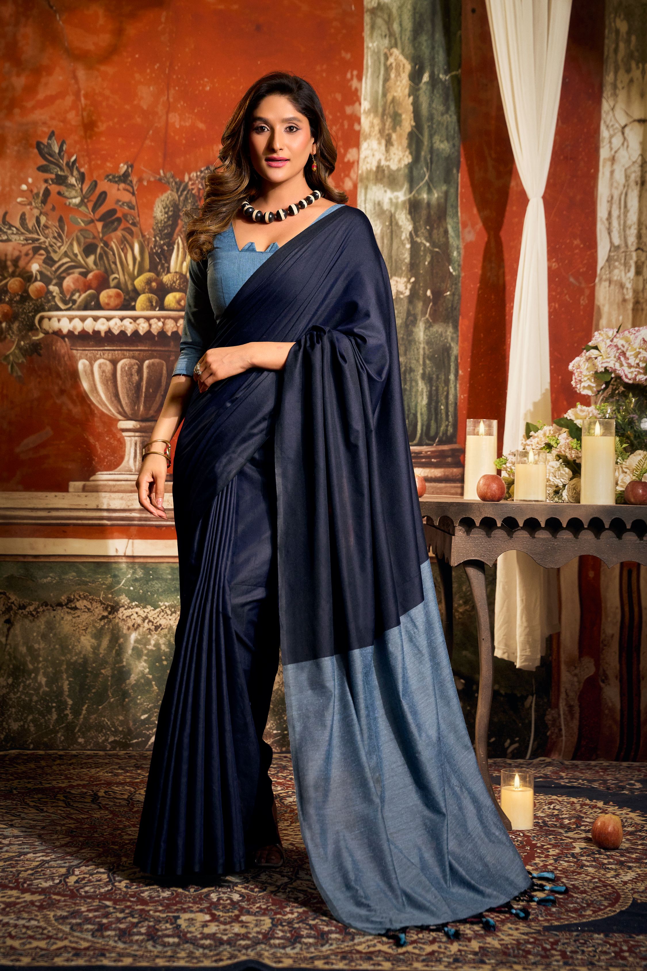 Navy blue cotton saree with contrast pallu and decorative fancy tassels