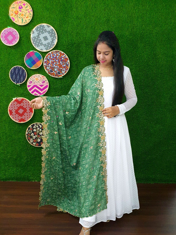White Georgette Anarkali dress with intricate Butti embroidery work
