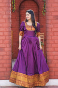 Purple silk Anarkali dress with gold jacquard weaving and festive floor-length design
