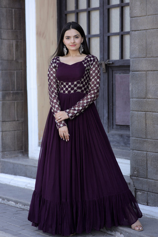 Wine-colored floor-length Anarkali dress with gold zari and sequins