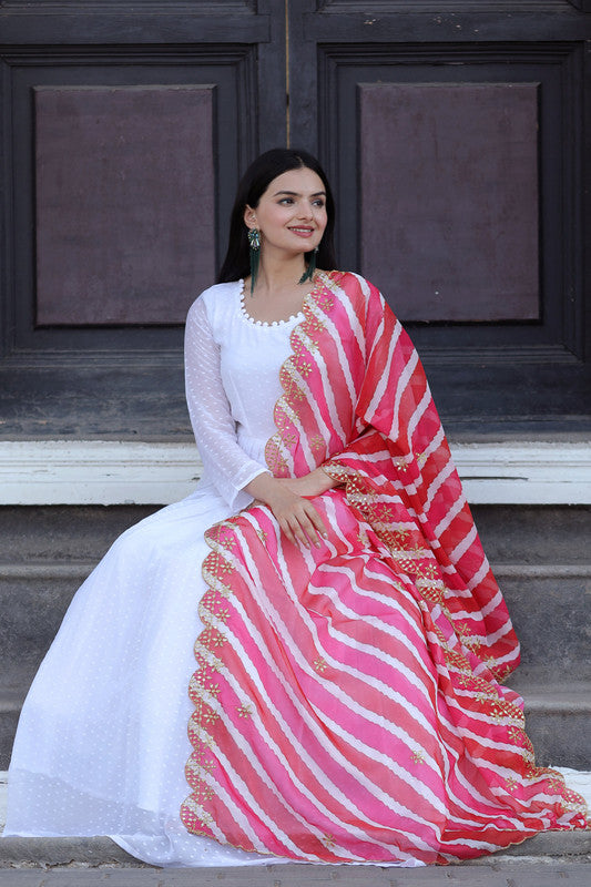 White georgette Anarkali dress featuring delicate butti embroidery and floor-length flare