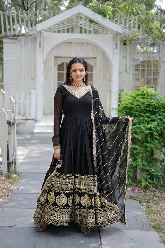 Elegant black faux blooming Anarkali dress covered in shimmering sequins embroidery.