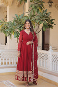 Woman wearing a maroon faux blooming Anarkali dress with intricate sequins embroidery and a matching dupatta.