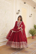 Woman wearing a maroon floor-length Faux Blooming Anarkali dress with silver sequins embroidery