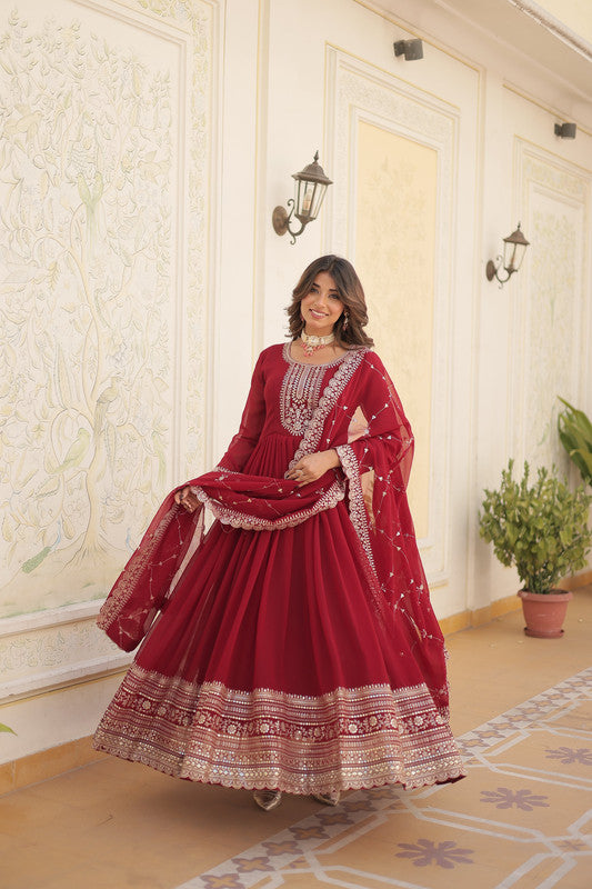 Woman wearing a maroon floor-length Faux Blooming Anarkali dress with silver sequins embroidery