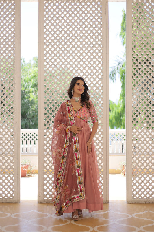 Stunning Peach Faux Georgette Anarkali dress with delicate sequins and zari embroidery