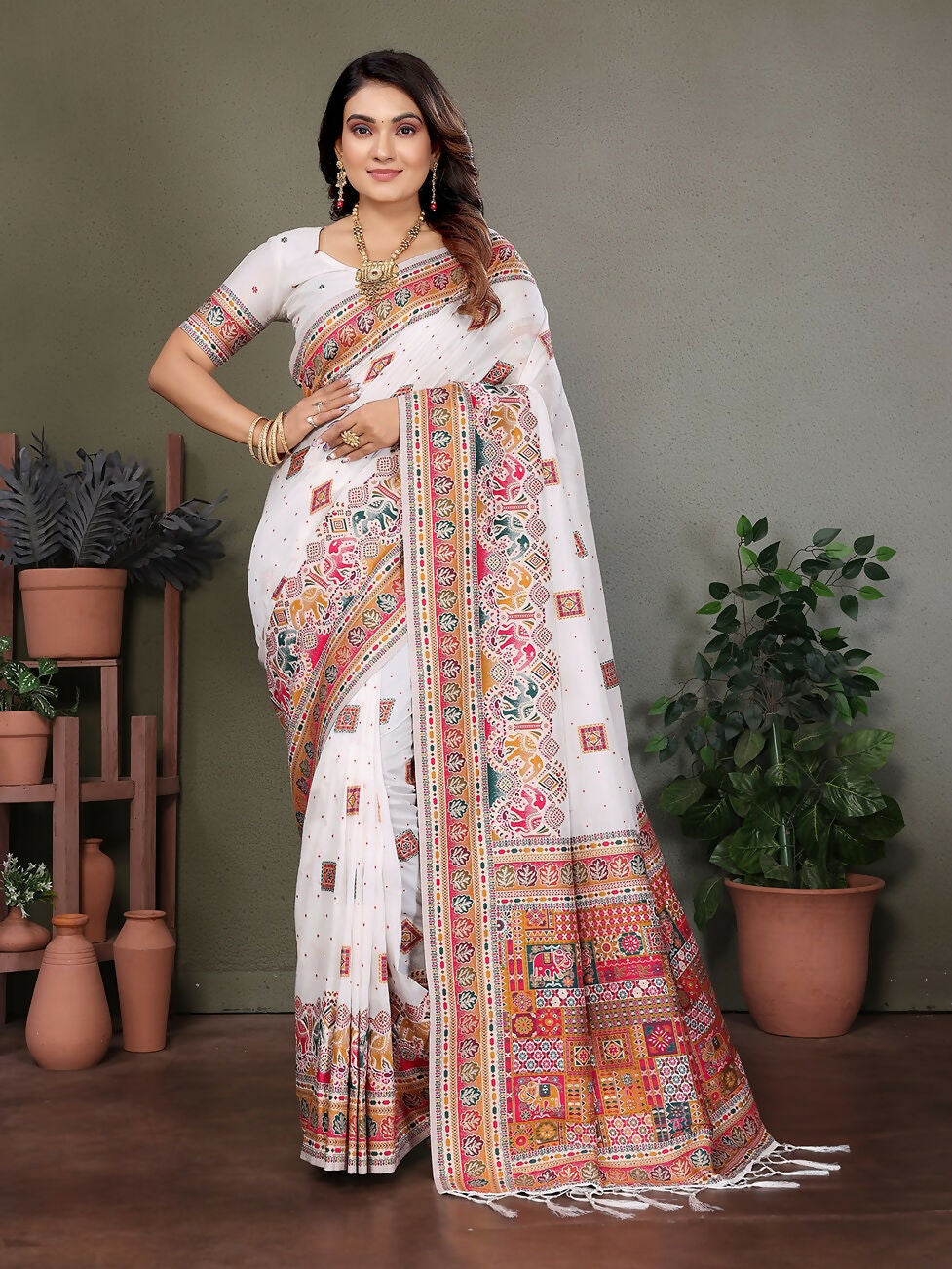 Elegant white soft silk saree with intricate thread-woven patterns and matching unstitched blouse piece