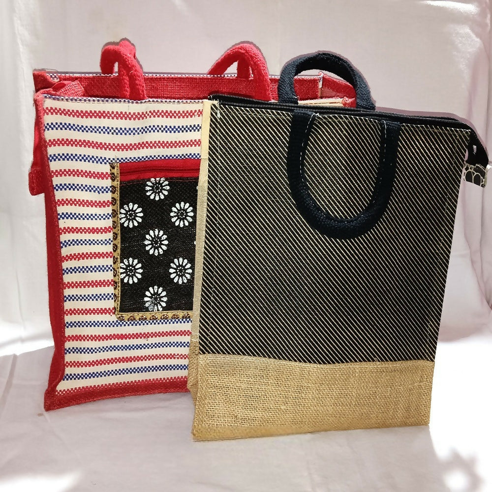 Set of two striped jute fashion bags in orange, red, black, and tan with geometric patches and zip closures.