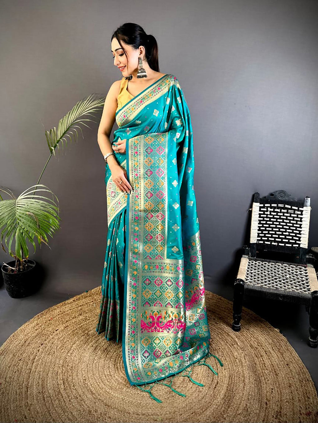Elegant teal Banarasi Lichi Silk saree with intricate Meenakari weaving and a purple blouse