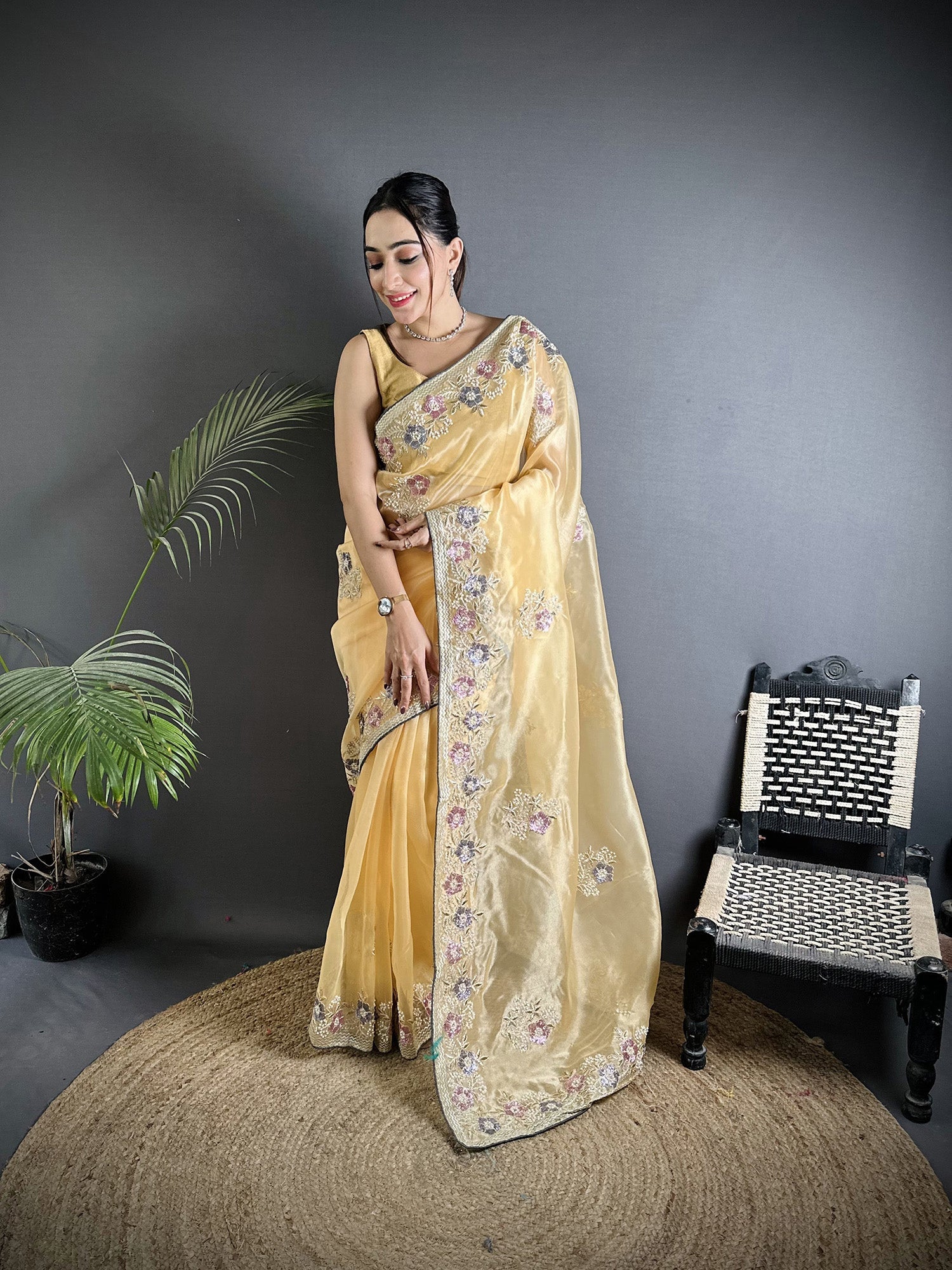 Bright Yellow Organza silk saree with shimmering double sequence work.