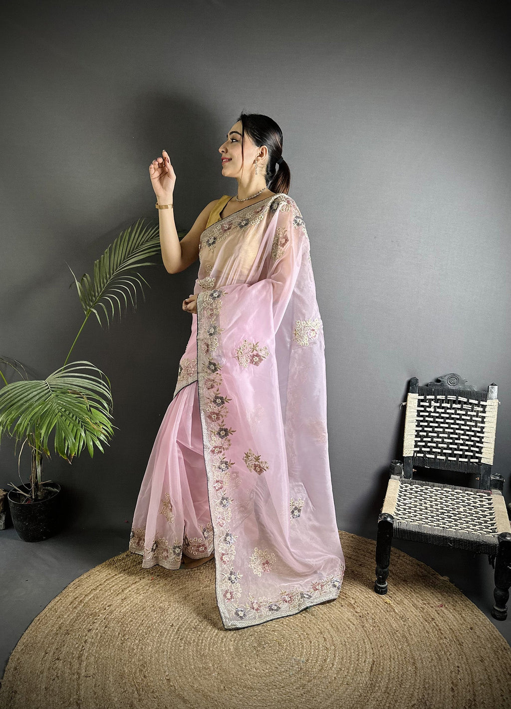 Light Pink Organza silk saree adorned with double sequence work and matching blouse.