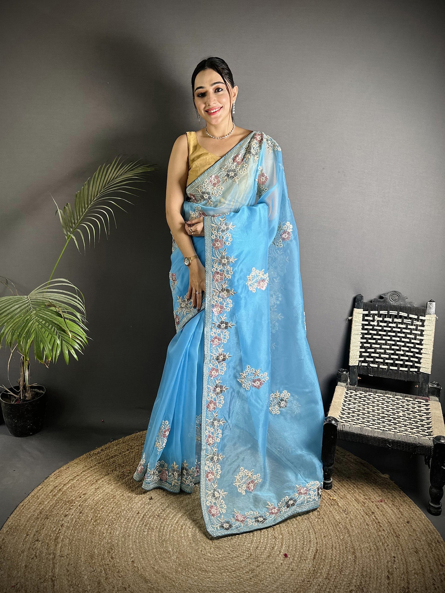 Light Turquoise Organza silk saree featuring double sequence embellishments.