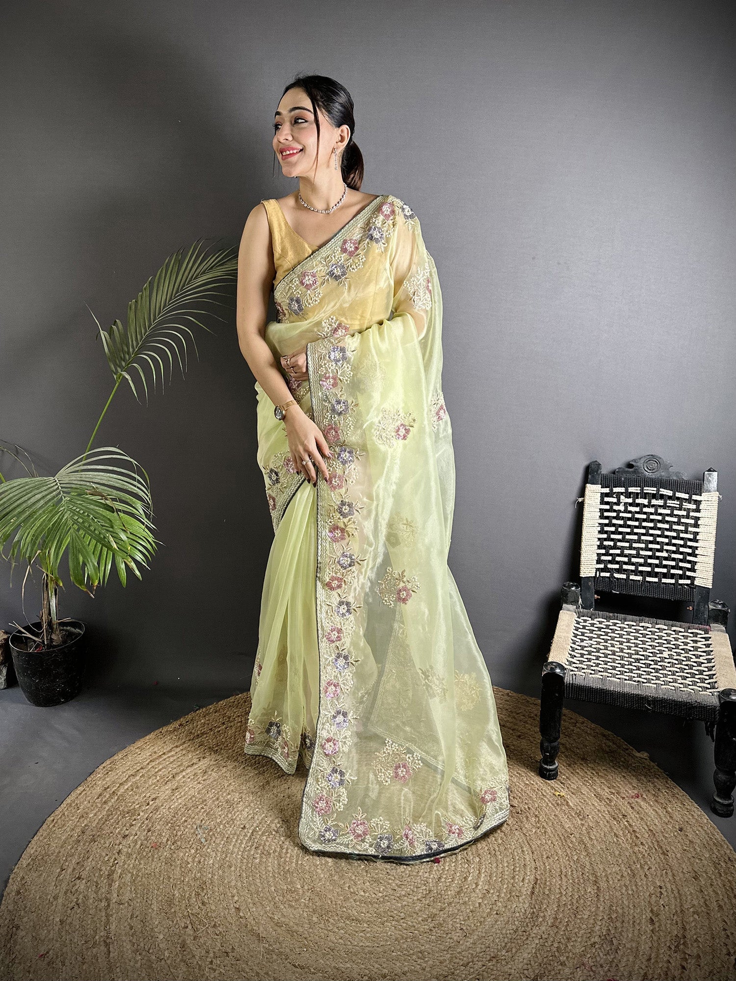 Pale Prim Yellow Organza Silk saree with double sequence pattern and unstitched grey blouse