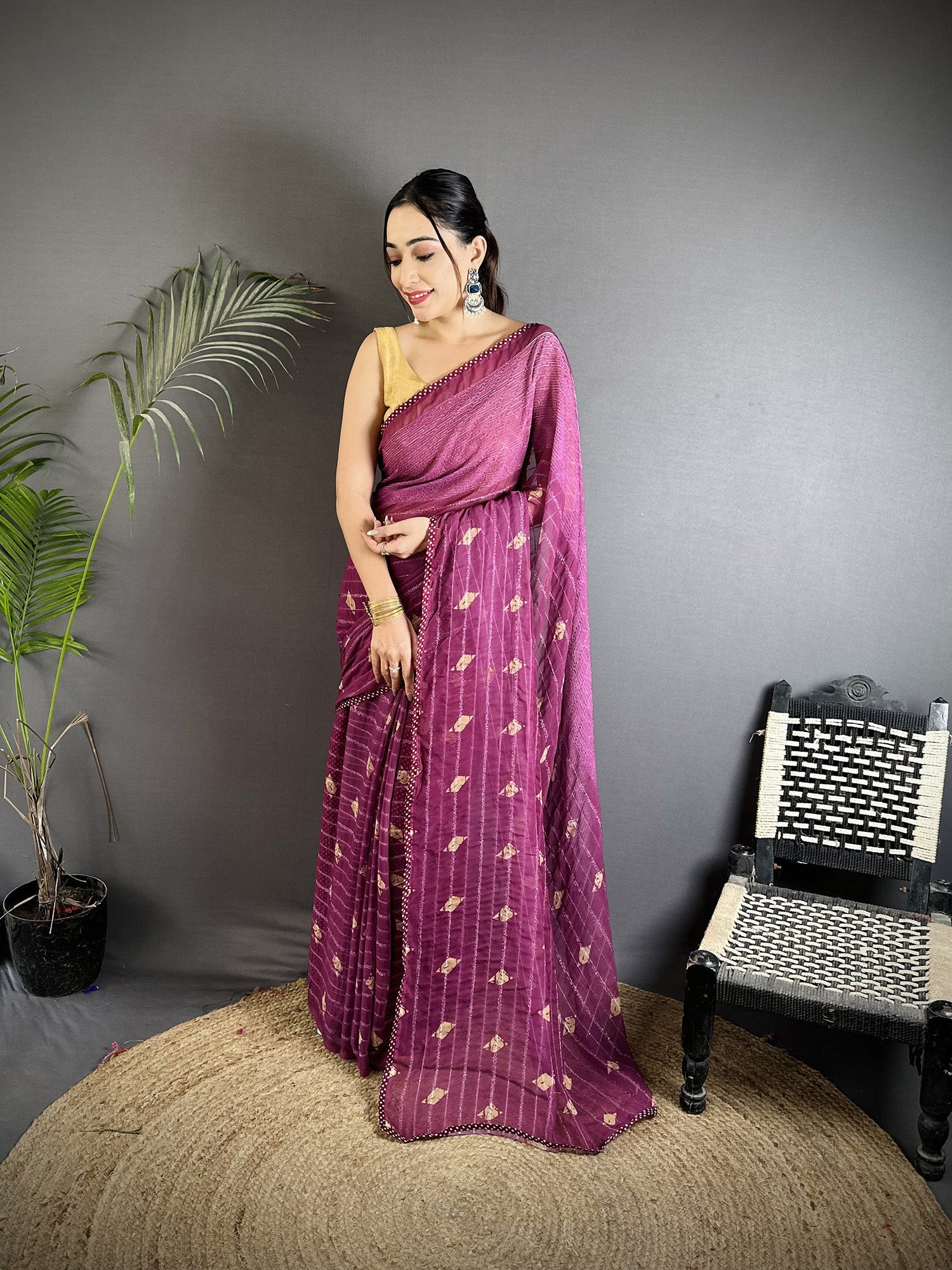 Purple georgette saree featuring a polka dot print