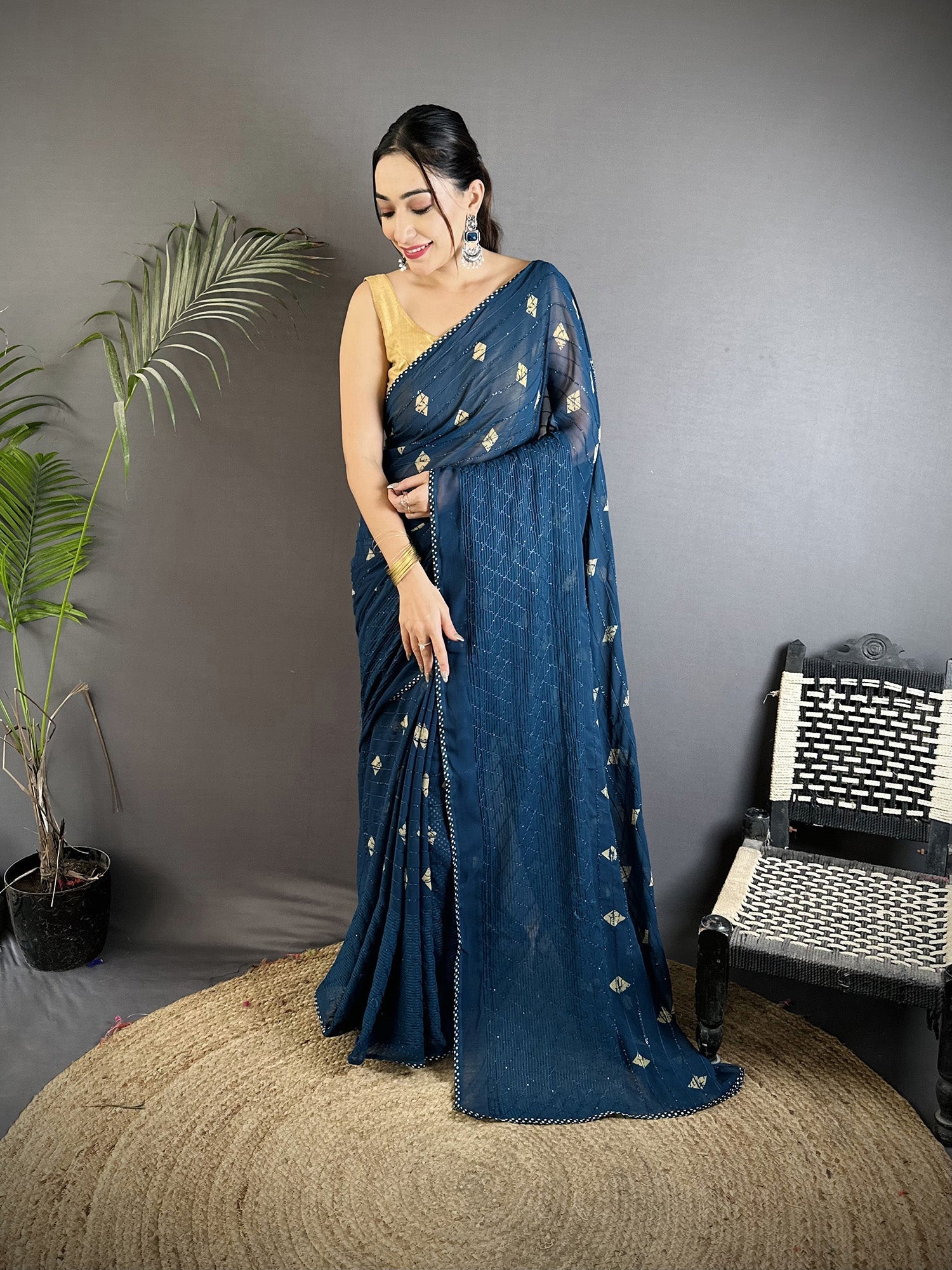 Blue georgette saree with a classic polka dot print pattern