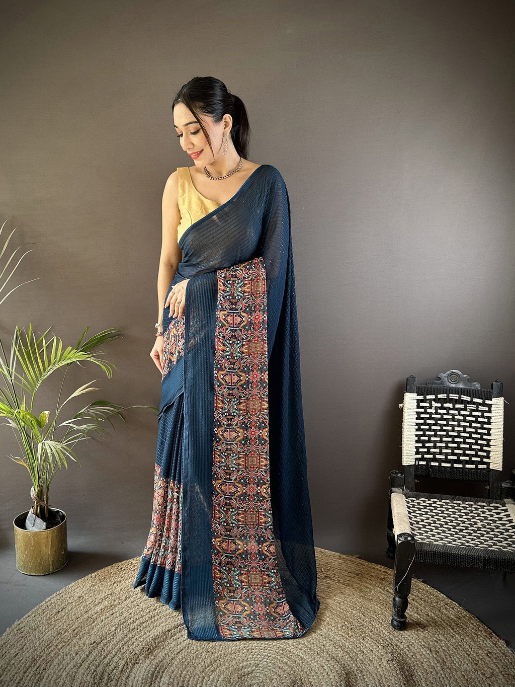 Blue georgette saree featuring shimmering foil print patterns with matching blouse fabric