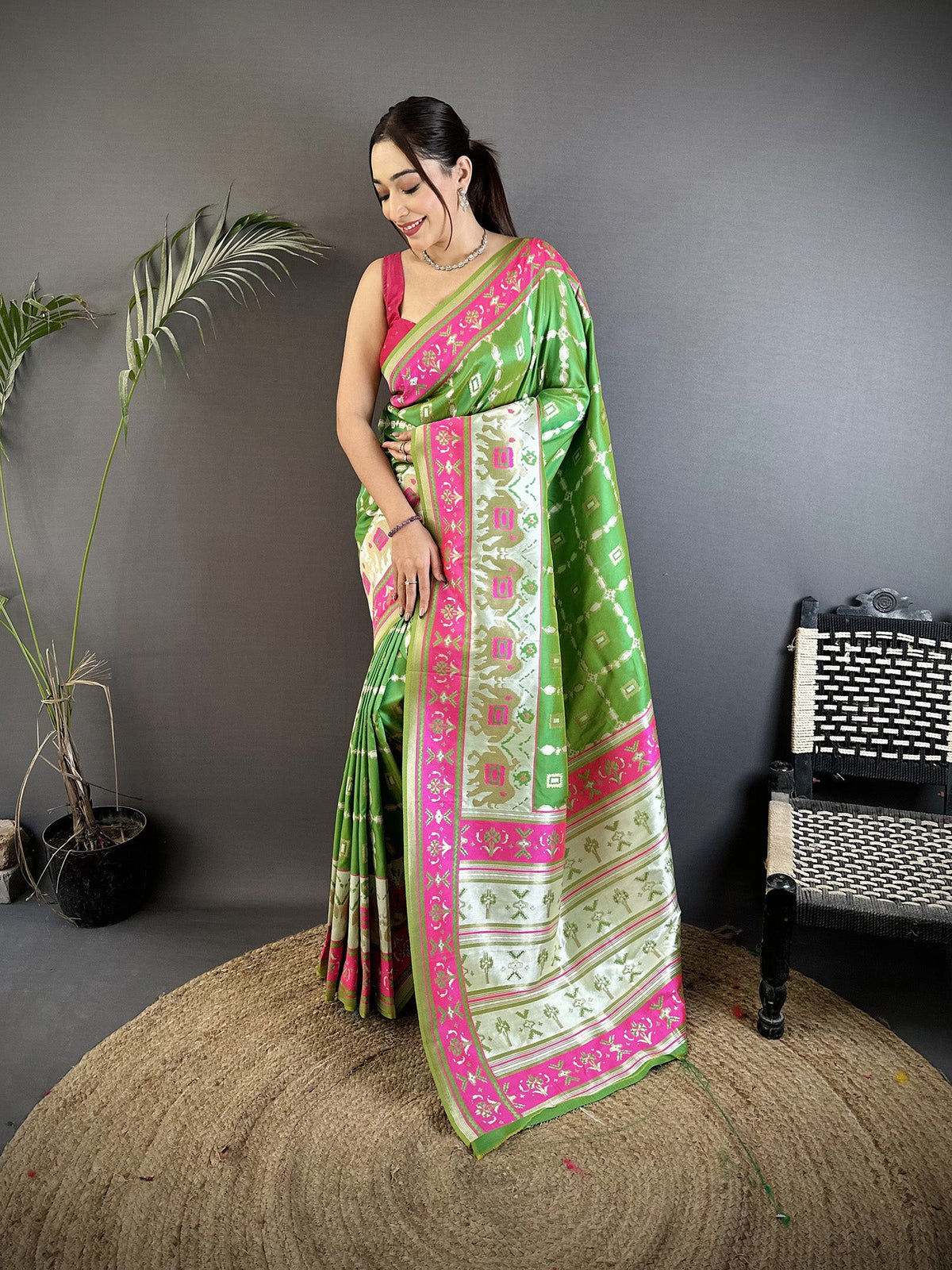 Parrot Green Banarasi Silk saree with detailed nature-inspired motifs
