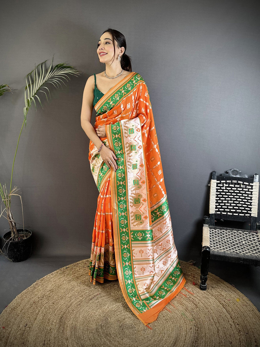 Bright Orange Banarasi Silk saree with intricate nature-inspired design