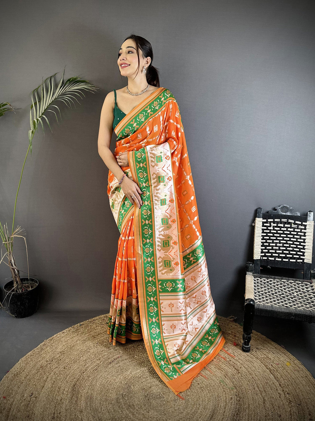 Bright Orange Banarasi Silk saree with intricate nature-inspired design