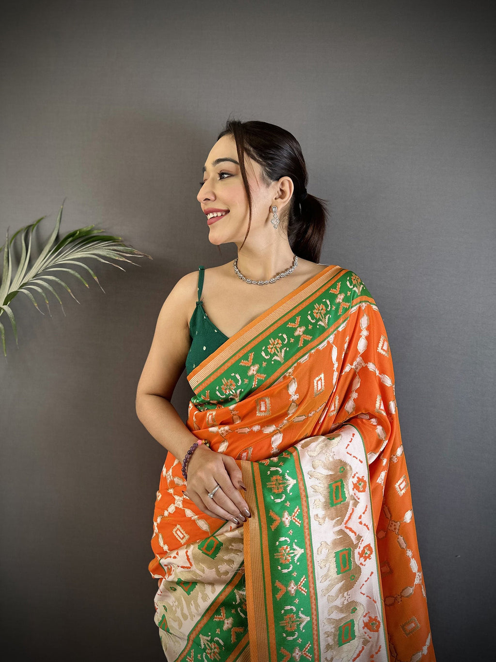 Orange Banarasi Silk Saree with Nature-Inspired Motifs
