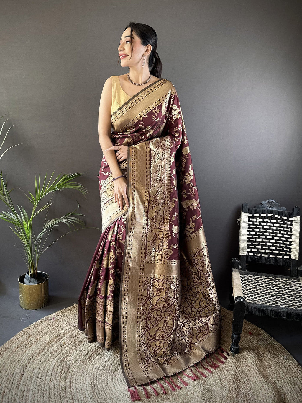 Brown Banarasi soft Lichi silk saree with detailed floral and shimmering gold zari patterns