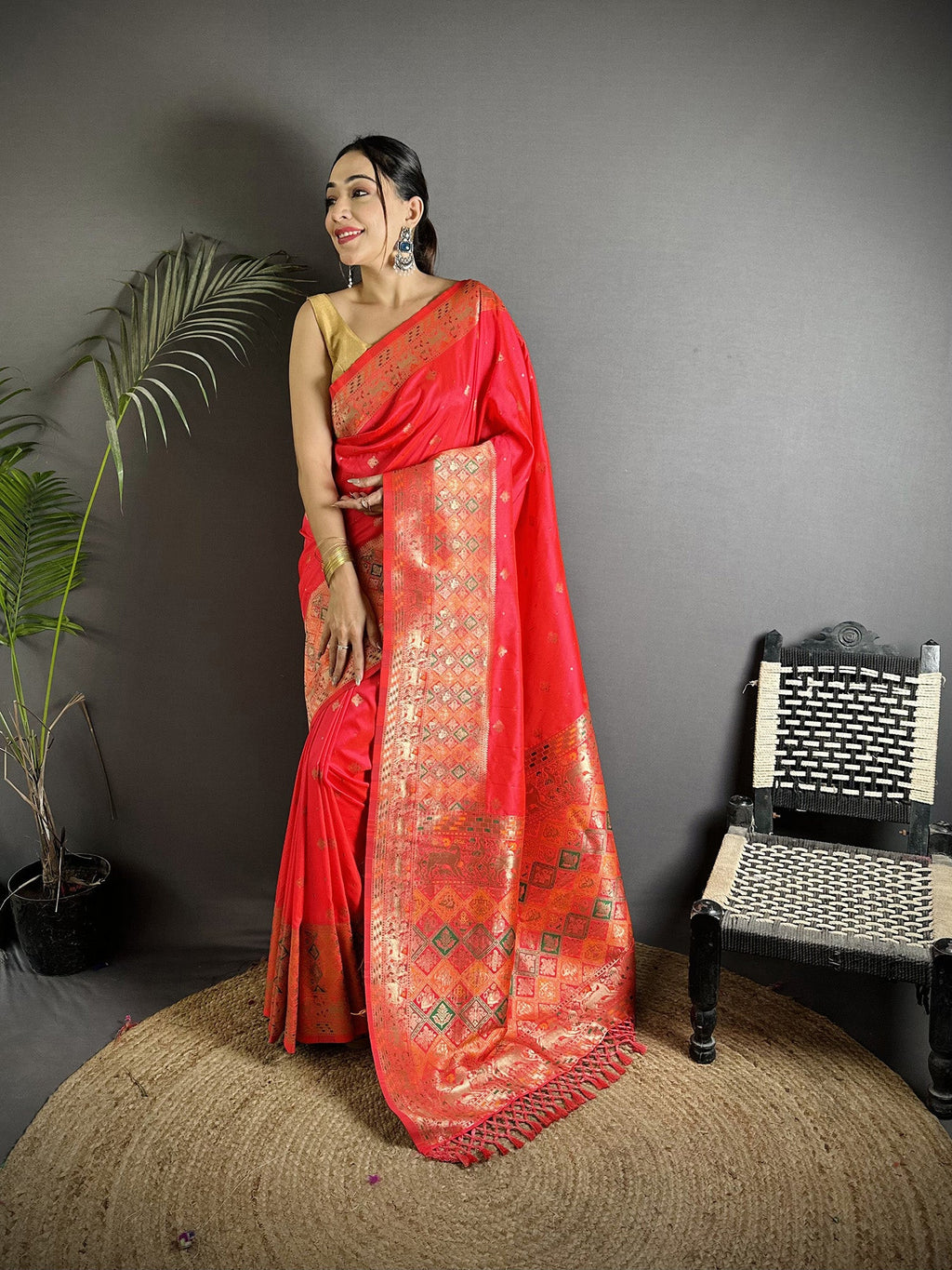 Coral Red Lichi Silk saree with intricate multicolour Minakari weaving and matching blouse.