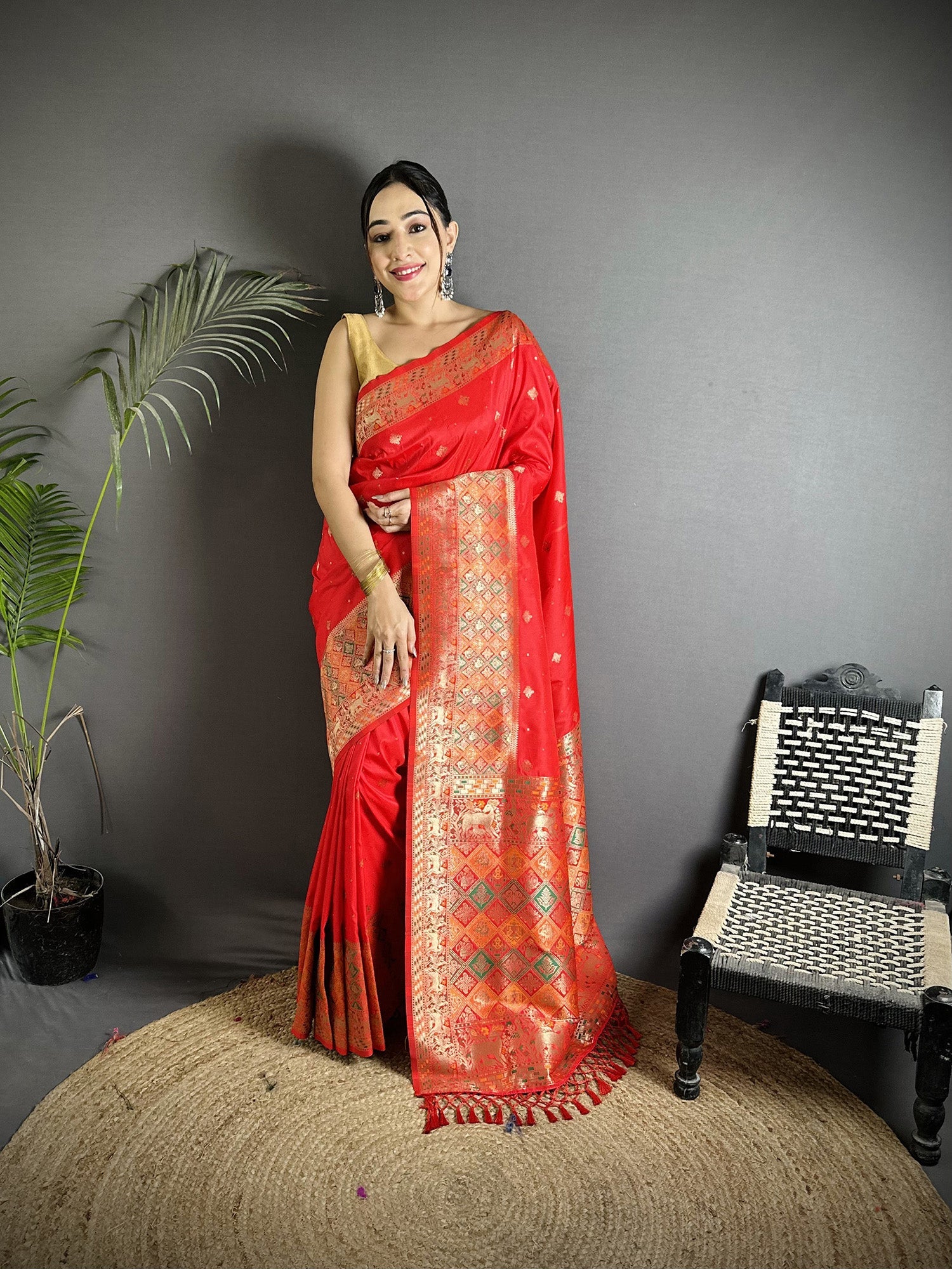 Red Soft Lichi Silk saree with multicolour Minakari weaving pattern and orange unstitched blouse.