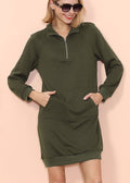 A model wearing a solid color long sleeve sweater dress with a zip-up collar and front kangaroo pocket