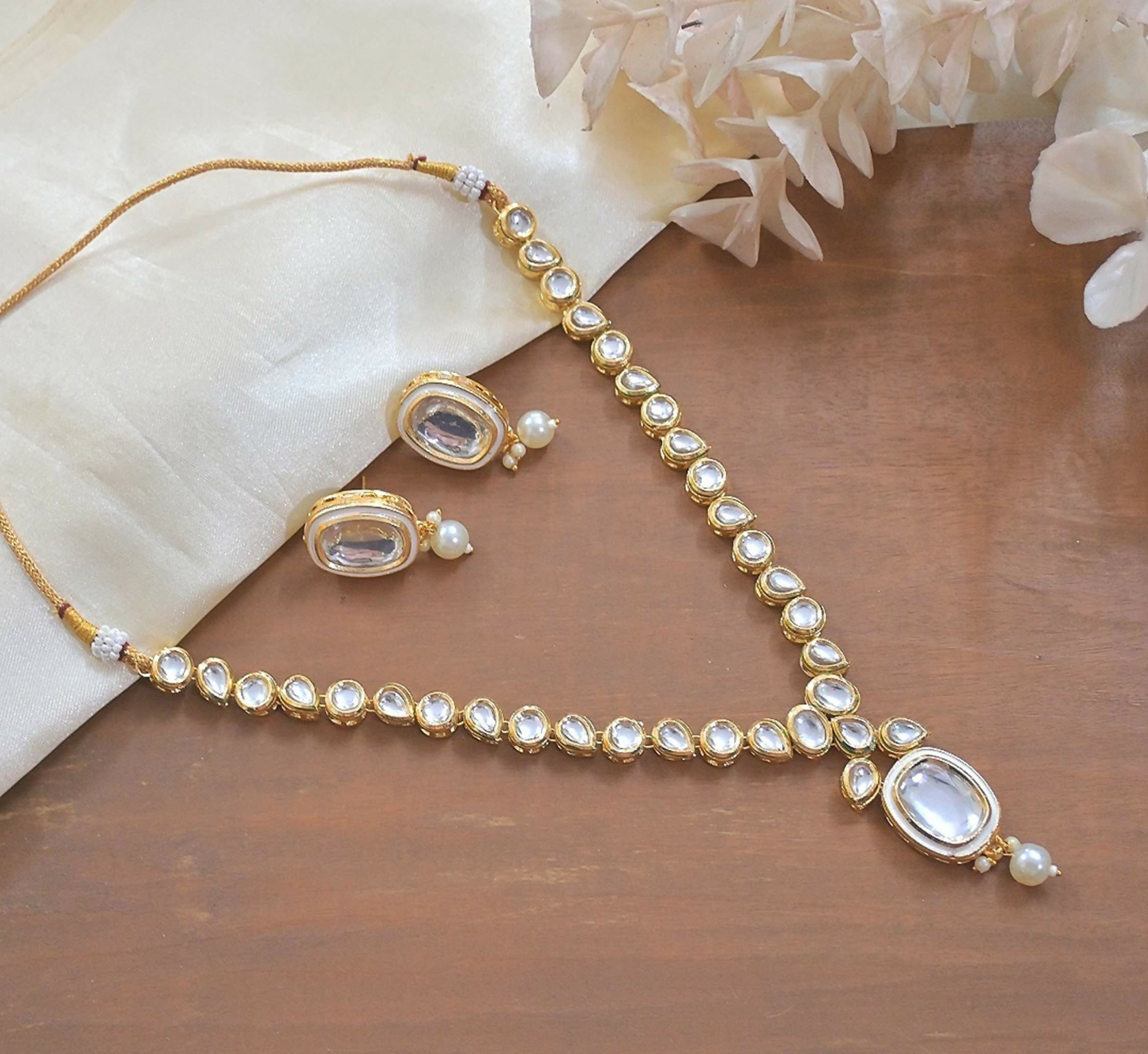 Classic off-white Kundan choker necklace made with copper, perfect for traditional attire