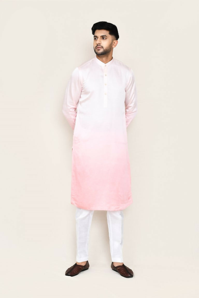 Model wearing a white satin silk kurta with matching straight-fit pants.