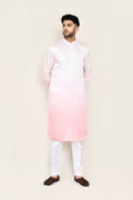 Model wearing a white satin silk kurta with matching straight-fit pants.